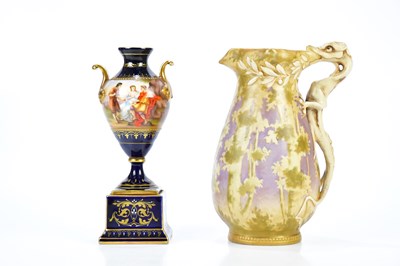 Lot 1372 - VIENNA; a hand painted twin handled urn vase,...