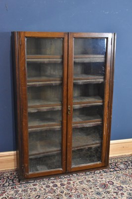 Lot 148 - A 19th century oak narrow bookcase, with two...