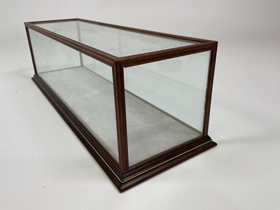 Lot 45 - A glass and wood display case, height 15cm,...