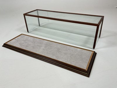 Lot 45 - A glass and wood display case, height 15cm,...