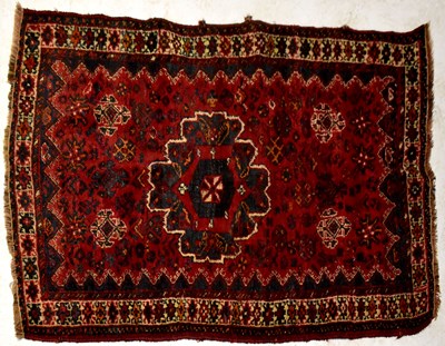 Lot 58 - An Iranian Yolmut Kepsi navy blue and dark red ground hand knotted rug