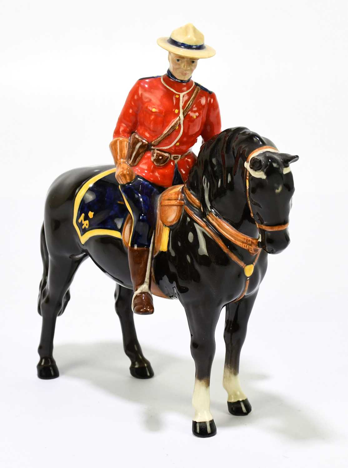 Lot 570 - BESWICK; a model of a Canadian Mounted...