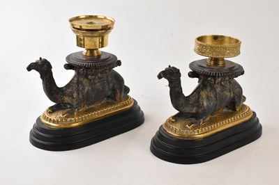 Lot 2198 - Two modern bronzed and brass candle holders...