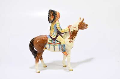 Lot 571 - BESWICK; a model of a Native American on...