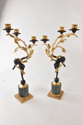 Lot 2194 - A pair of ormolu and bronze effect three...