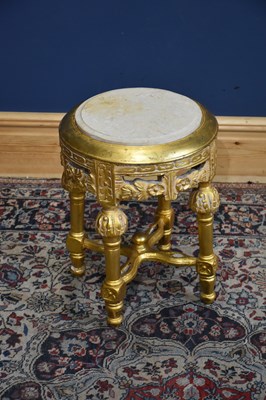 Lot 198 - A decorative modern gilt painted marble topped...