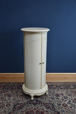 Lot 208 - A modern decorative cream cylindrical cabinet,...