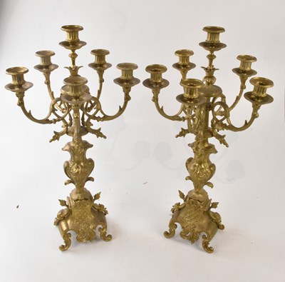 Lot 2215 - A pair of modern brass six branch candelabra...