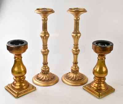 Lot 2231 - A pair of gilt candle holders, height 48cm,...