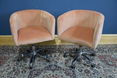 Lot 200 - A pair of modern pink upholstered swivel bar...