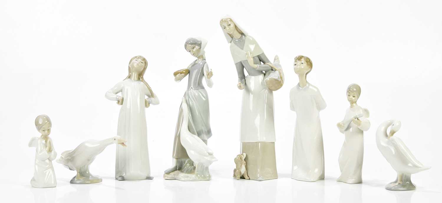 Lot 1421 - LLADRO; a collection of six ceramic figures...