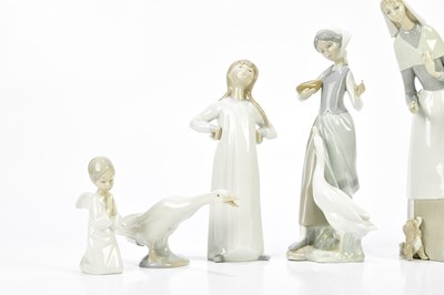 Lot 1421 - LLADRO; a collection of six ceramic figures...