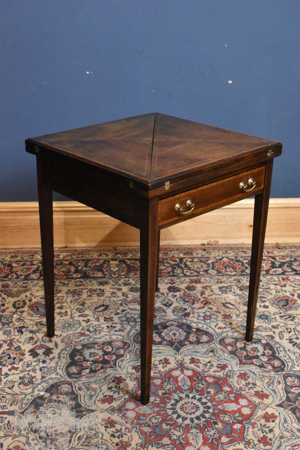 Lot 68 - An Edwardian mahogany envelope card table,