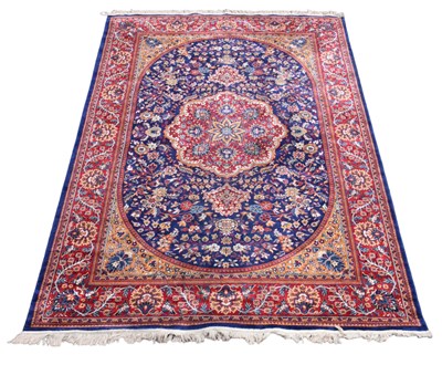 Lot 338 - A Sarook Kashan machine woven part silk carpet,...