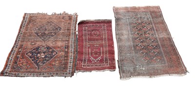 Lot 353 - A Caucasian handwoven wool rug worked with a...