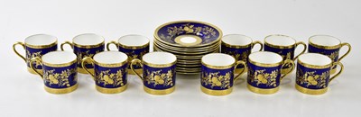 Lot 1360 - MINTON; a set of twelve blue and gilt coffee...