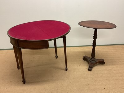 Lot 672 - A 19th century tripod table and a demi-lune...