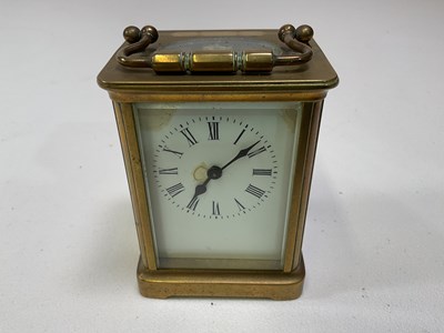 Lot 566 - A circa 1900 French brass carriage clock, the...