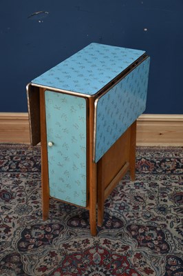 Lot 320 - A 1950s Formica drop-leaf table with single...