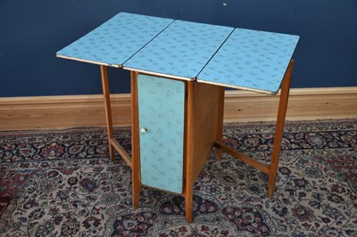 Lot 320 - A 1950s Formica drop-leaf table with single...