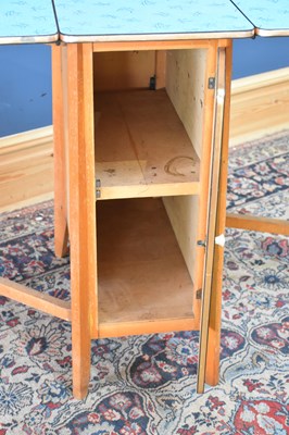 Lot 320 - A 1950s Formica drop-leaf table with single...