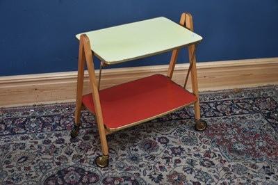 Lot 321 - A 1950s Formica two tier trolley.