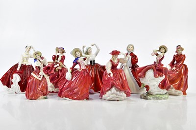 Lot 1429 - ROYAL DOULTON; a collection of nine figures...