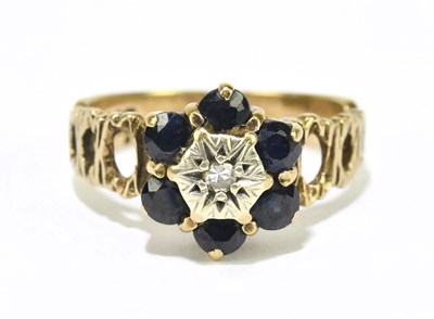 Lot 1200 - A 9ct yellow gold dark sapphire and tiny...