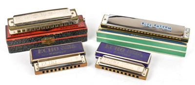 Lot 139 - Four cased harmonicas to include a super...