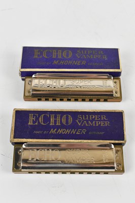 Lot 139 - Four cased harmonicas to include a super...