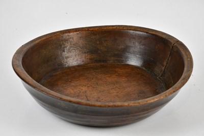 Lot 1042 - A 19th century turned sycamore dairy bowl,...