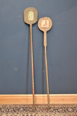 Lot 1068 - Two 19th century bread paddles, both with folk...