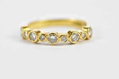 Lot 156 - An 18ct yellow gold and diamond collet set...