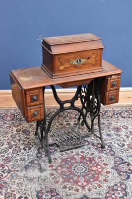 Lot 389 - SINGER; a treadle sewing machine, height 103cm,...