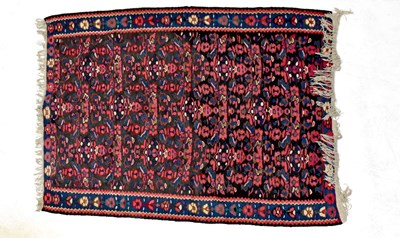 Lot 85 - An Afghan rug with all-over floral decoration...