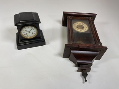 Lot 565 - A slate mantel clock and a wall clock