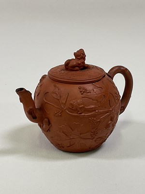 Lot 279 - A Chinese Yixing teapot decorated with...