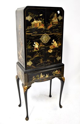 Lot 99 - A Japanned drinks cabinet/cupboard, the front...