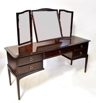 Lot 19 - A Stag Minstrel dressing table of one long and...