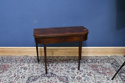 Lot 123 - A 19th century mahogany fold-over tea table,...