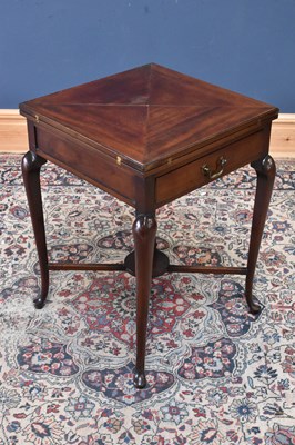 Lot 105 - An Edwardian mahogany envelope card table,...