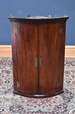 Lot 161 - A 20th century mahogany two door bowfronted...