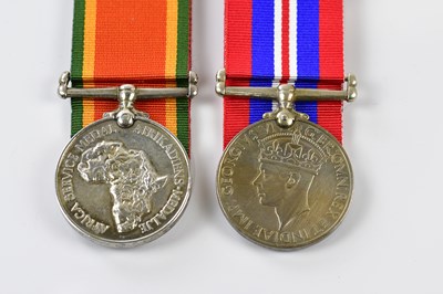 Lot 1543 - Two WWII medals with some associated paperwork,...