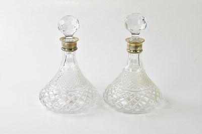 Lot 1469 - A pair of cut glass hallmarked silver collared...