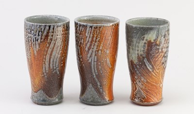 Lot 372 - Maze Hill Pottery; a trio of tall stoneware...