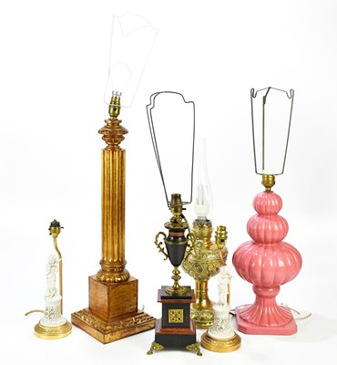 Lot 2225 - A collection of six lamps, to include a wood...