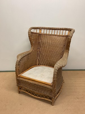 Lot 717 - A wicker conservatory chair, height 102cm.