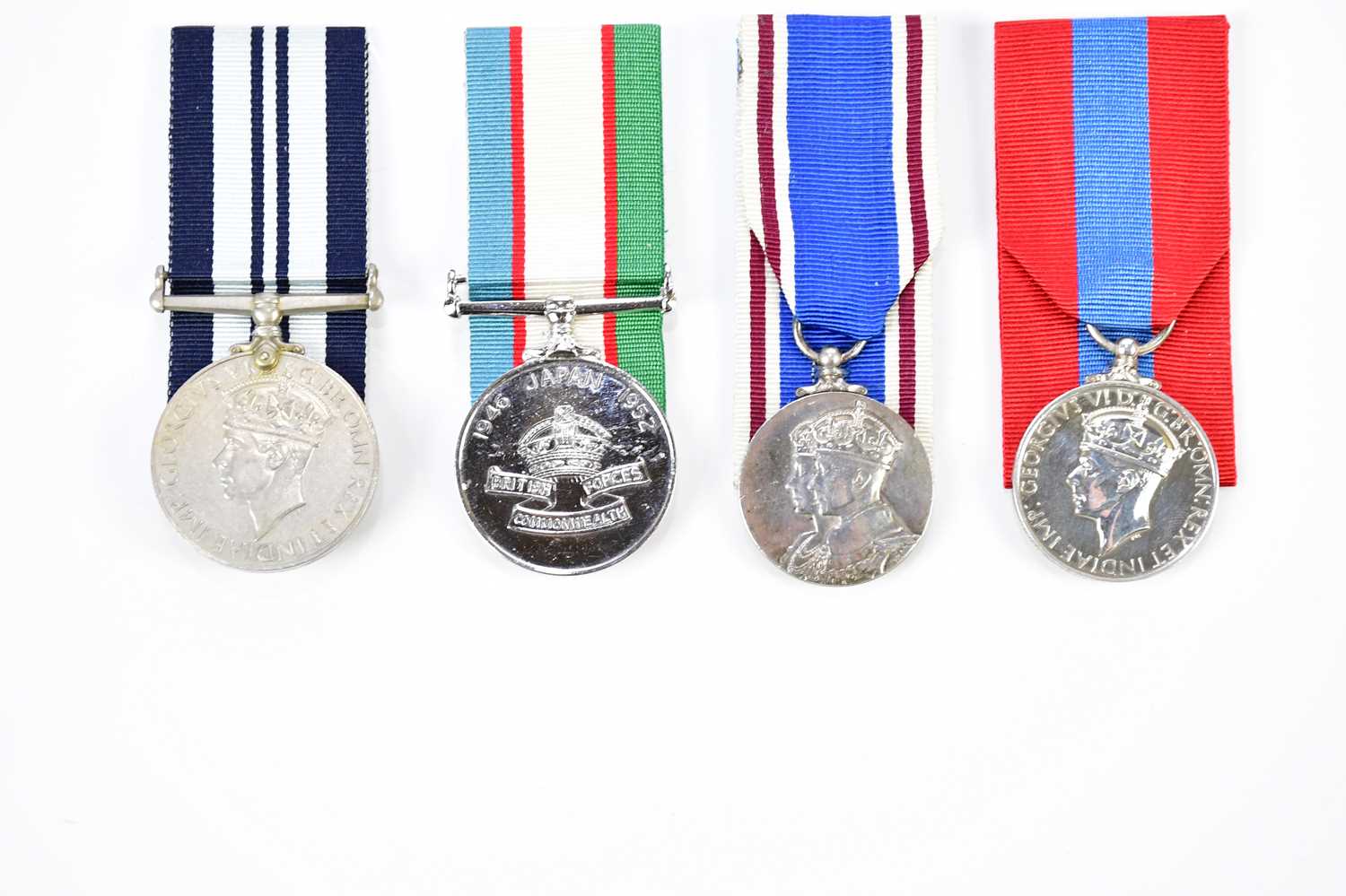 Lot 1574 - Four George VI medals comprising a WWII India...