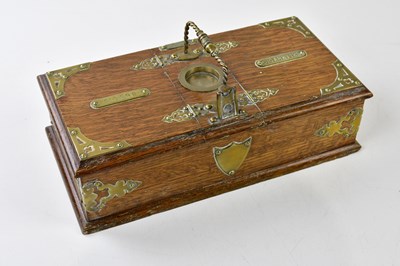 Lot 1084A - An Edwardian oak and brass mounted...