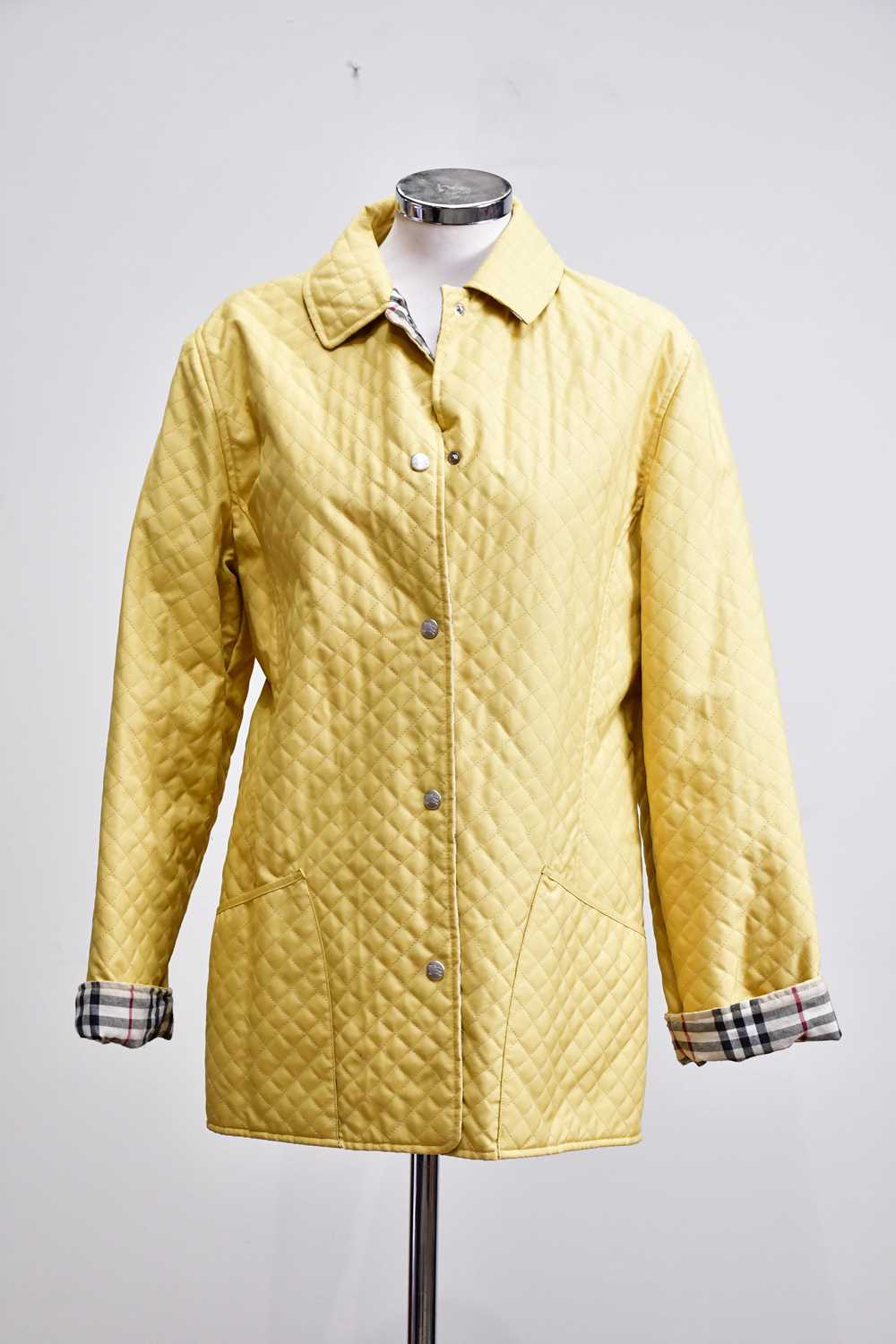 Lot 887 BURBERRY; a mustard yellow quilted jacket